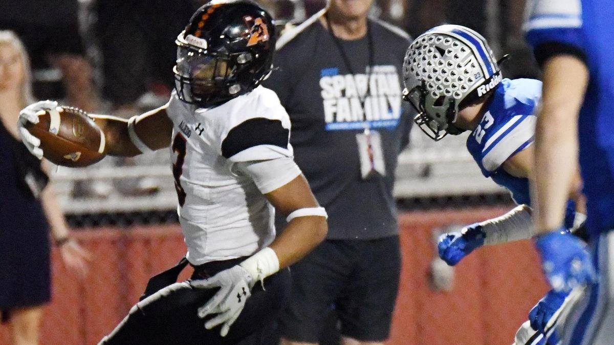 Aledo’s Davhon Keys, left runs up the sideline past Centennial’s Ben Meyer into the endzone for the in a October 2022 game.