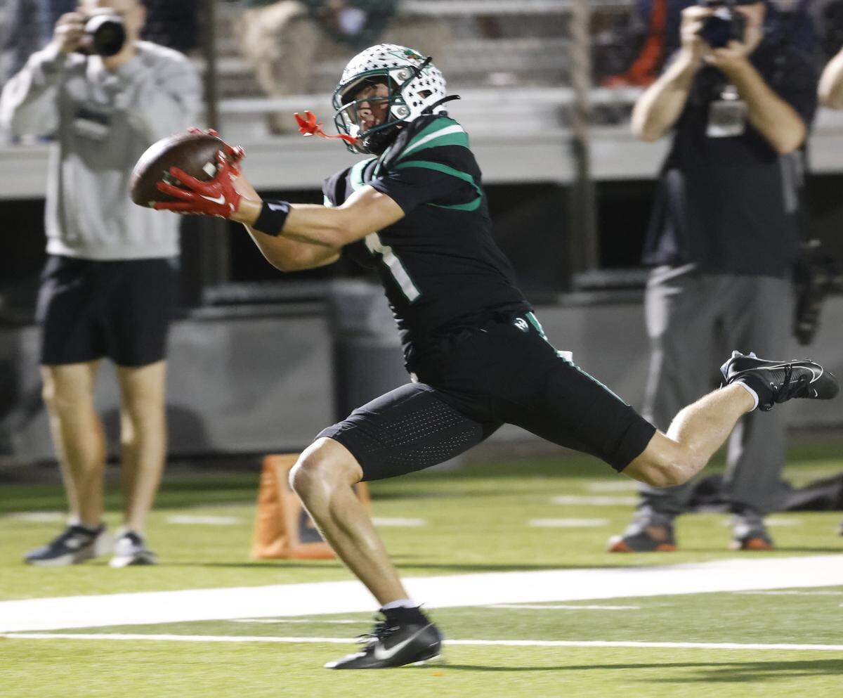 Southlake Carroll wide receiver Brock Boyd makes a fingertip grab for a first down during a playoff win over Crowley on Nov. 13 at Dragon Stadium in Southlake.
