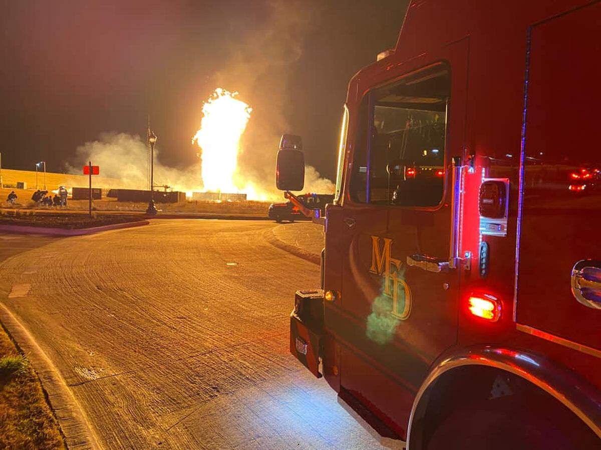 One person was seriously injured in a large fire after a car crashed into a natural gas pipeline in Mansfield early Wednesday morning, fire officials said.