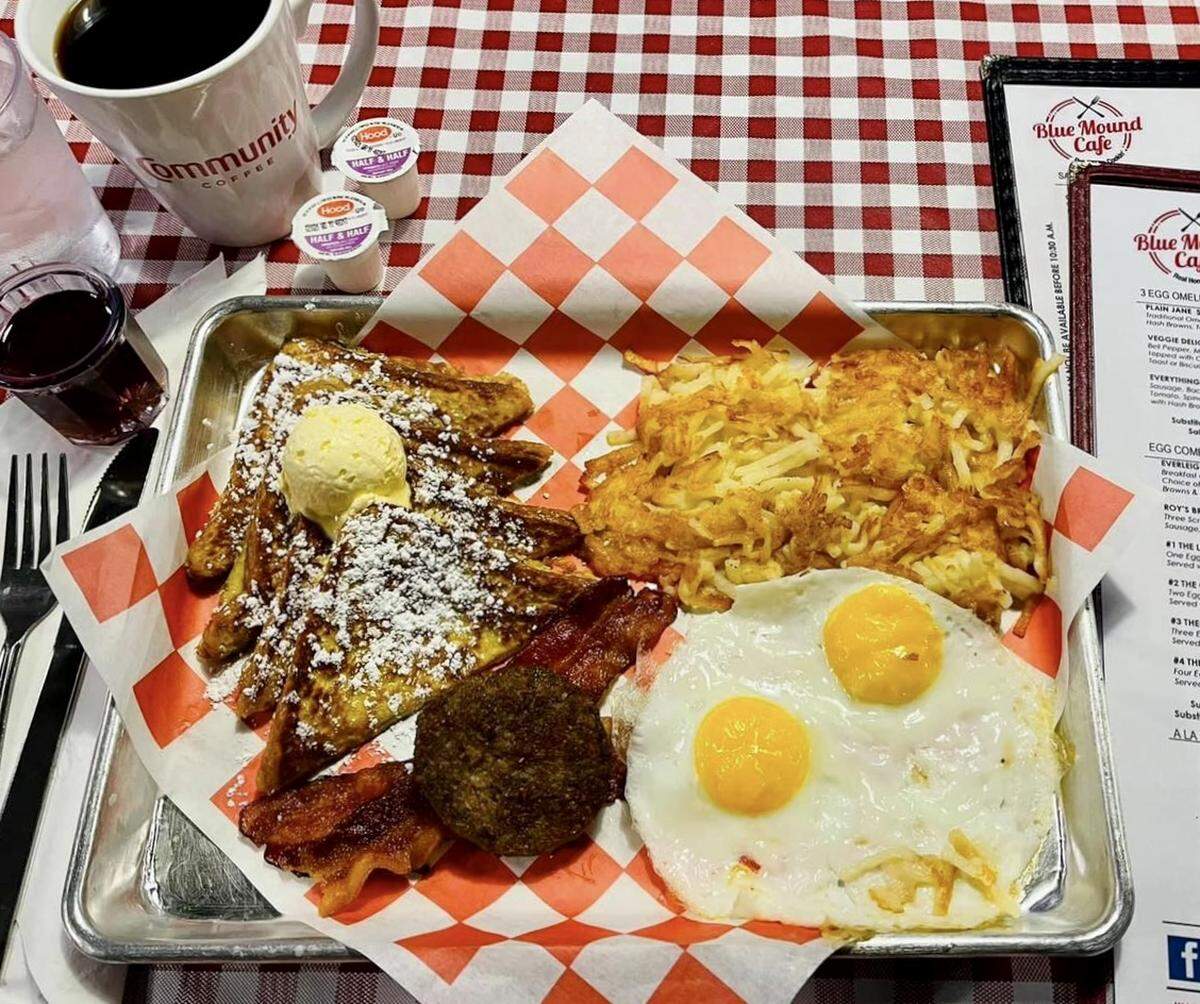 The “Frencher” breakfast combo with French toast, eggs, bacon and sausage at Blue Mound Cafe.