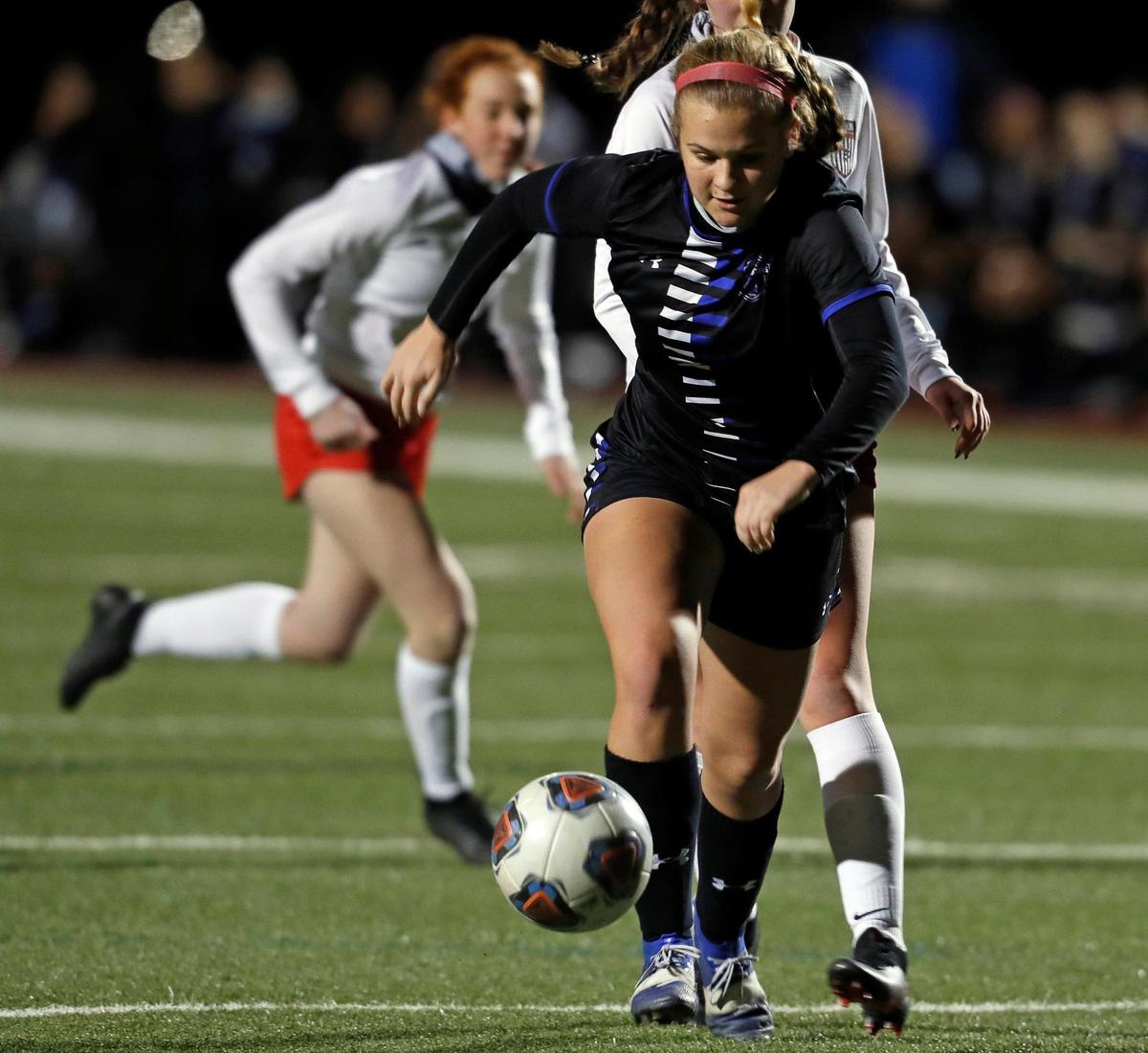 Centennial Brooke Mullins (5) kicks in their third goal during a 8-5A girls soccer game at Burleson Centennial in Burleson, Texas, Friday, Feb. 05, 2021. Centennial defeated Burleson 6-0. (Special to the Star-Telegram Bob Booth)