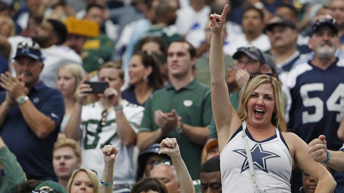 A Cowboys fan cheers during team intros before the Green Bay Packers play the Dallas Cowboys in Arlington, Texas, Sunday, Oct. 8, 2017.