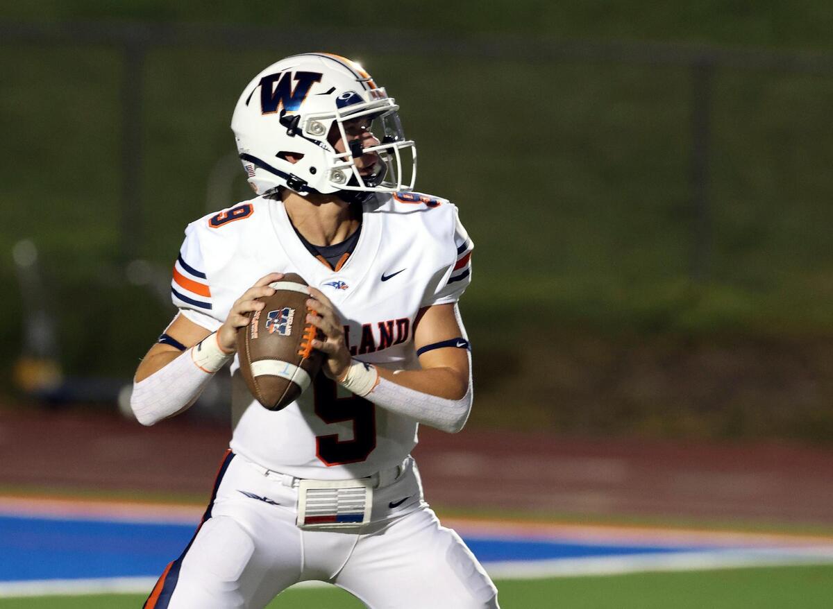 Wakeland quarterback Brennan Myer (9) tosses a completion down field in the first half of an UIL football game at Mustang-Panther Stadium in Grapevine, Texas, Thursday Aug. 24, 2023.