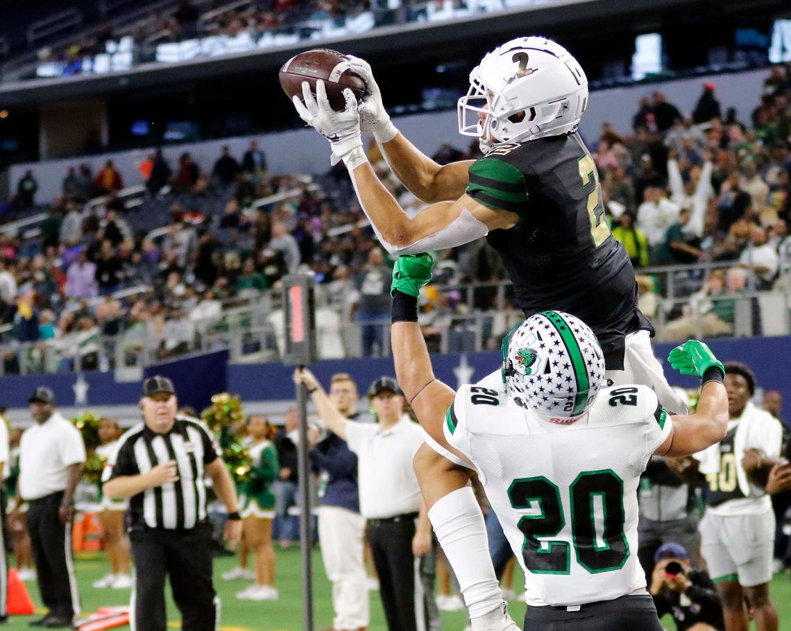 DeSoto wide receiver Lawrence Arnold (2) grabs a touchdown catch defended by Southlake defensive back James Miscoll (20) in the first half of a high school football playoff game at AT&T Stadium in Arlington, Texas, Friday, Nov. 22, 2019.