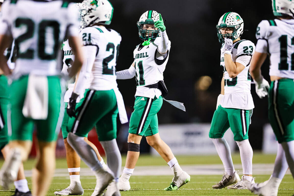 Southlake Carroll defensive back Taevin Kunz (11) points to the scoreboard in the second quarter during a district matchup against Keller Timber Creek on Thursday, September 25, 2025 at Keller ISD Stadium in Keller, Texas.