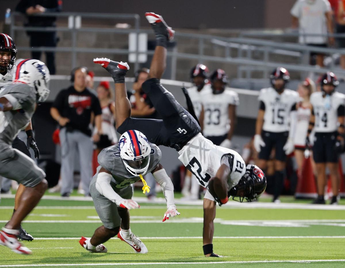 Colleyville defensive back Bryce Abram (21) gets tripped up after a short gain during a UIL football game at Birdville Fine Arts and Activity Center in North Richland Hills Friday, Sept. 6, 2004.