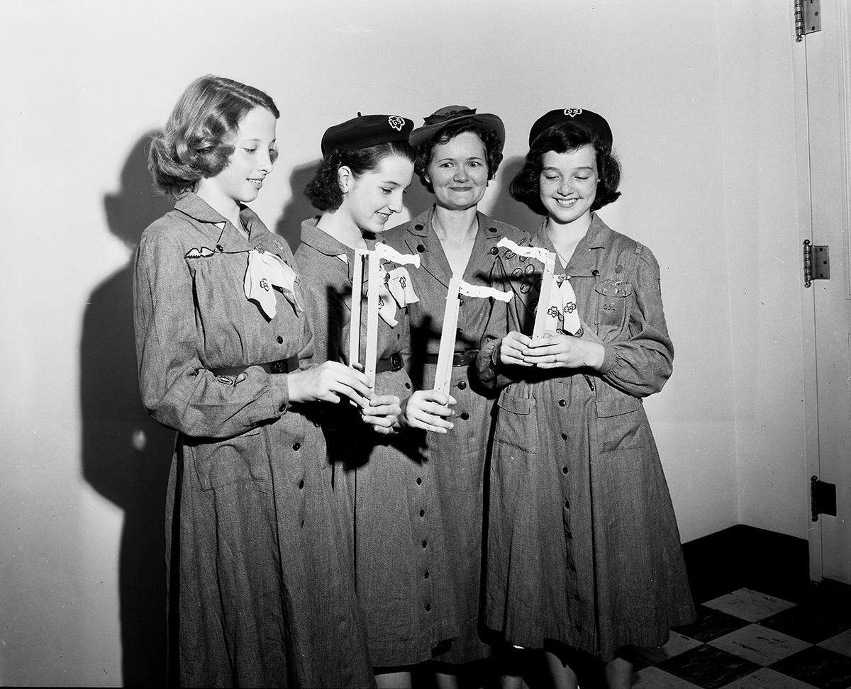 May 29, 1950: These four members of Girl Scout Troop 13, their leader and 10 other troopmates hope the children of City-County Hospital have as much fun with the toys the troop has made as they had making them. In the group distributing the jumping jacks were, left to right, Mina Mae Holt, Frances Barclay, Mrs. W.S. Owen, leader, and Scotty Owen.