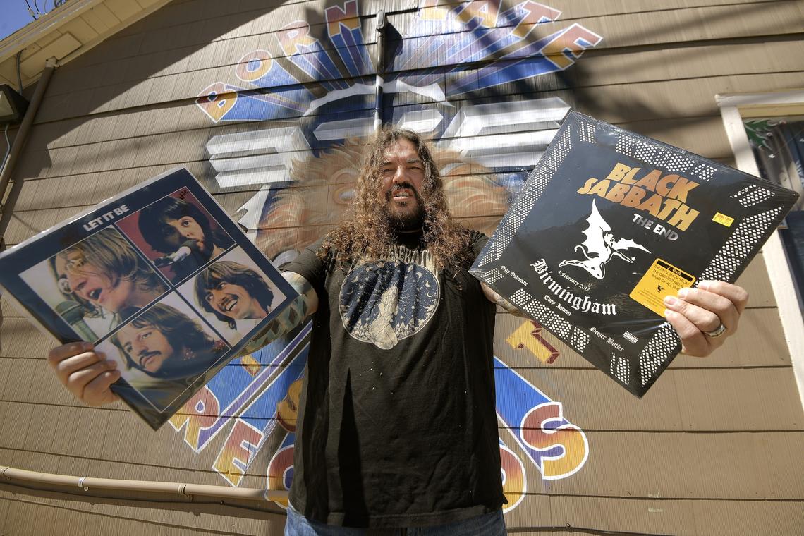 Henry Vasquez, owner of Born Late Records, standing outside of his shop on Race Street in the Six Points Urban Village in Fort Worth, TX, Tuesday, March 20, 2018.
