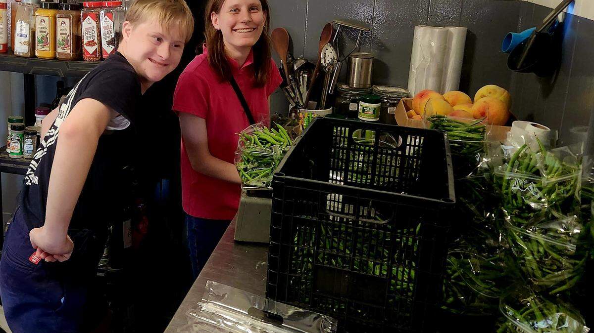 Johan Lohmann and Jessica Pendley enjoy working in the kitchen together at Stone’s Throw Farm. The nonprofit provides work opportunities for people with special needs and physical challenges.
