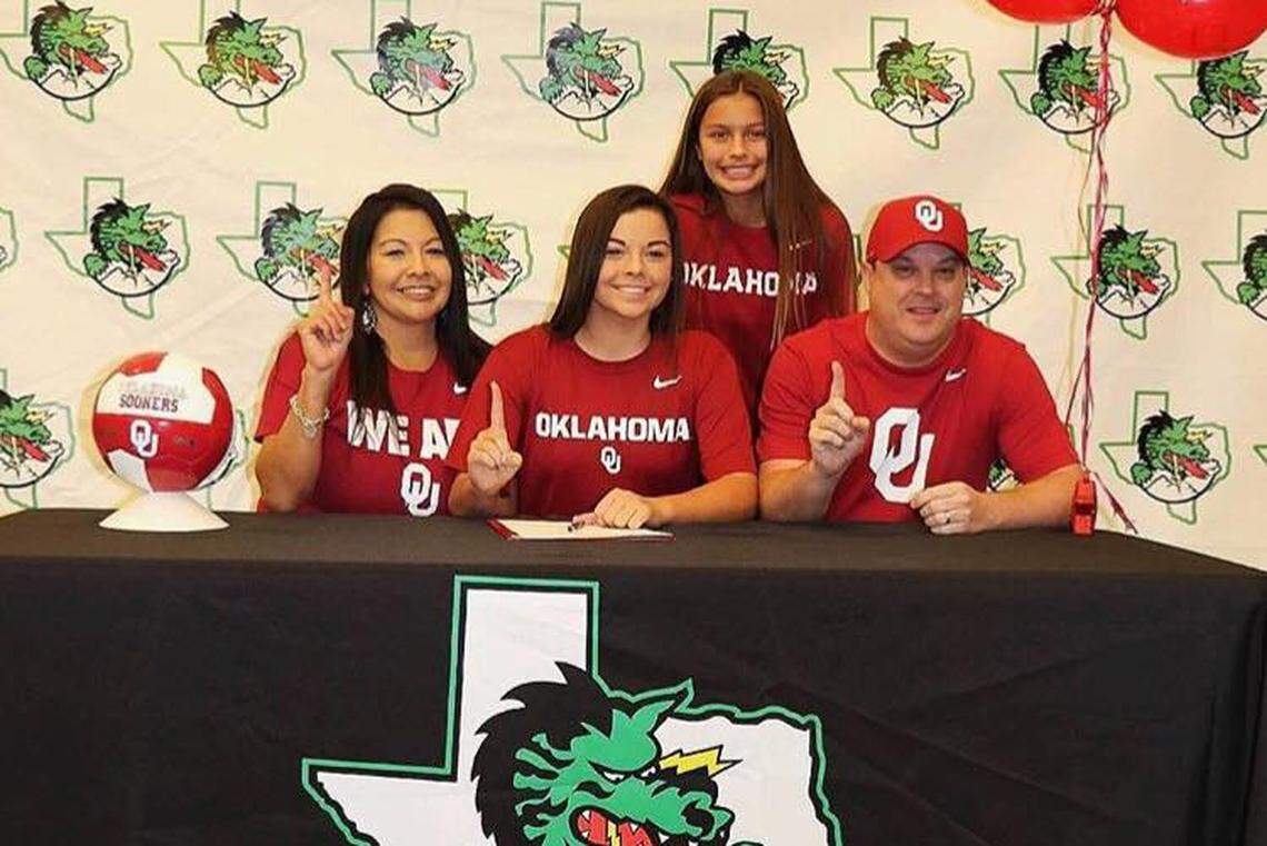 Taylor Tufts, middle, in November, signing her letter of intent to play soccer at the University of Oklahoma.