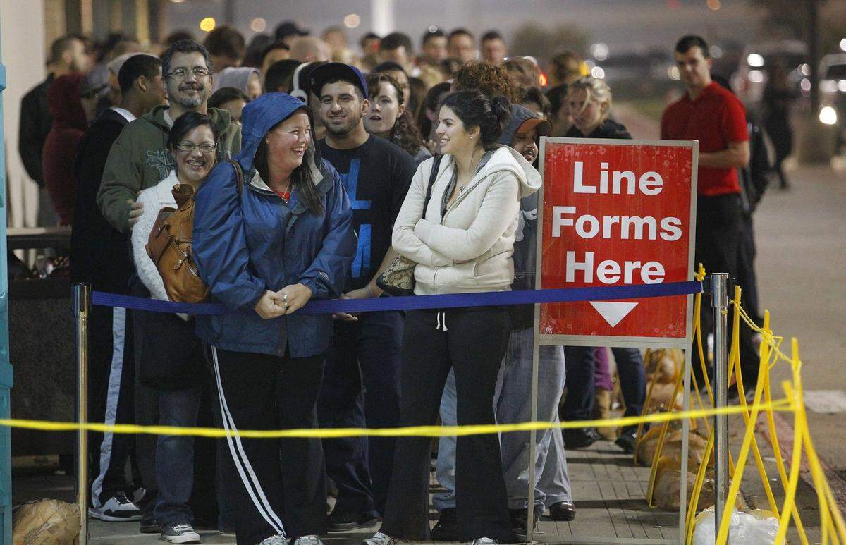 Nov. 24, 2011: The line is still long, but smiling, at almost 10 p.m., one hour after opening. Black Friday began on Thanksgiving as a huge throng of shoppers started their holiday shopping at Toys R Us in Hurst.