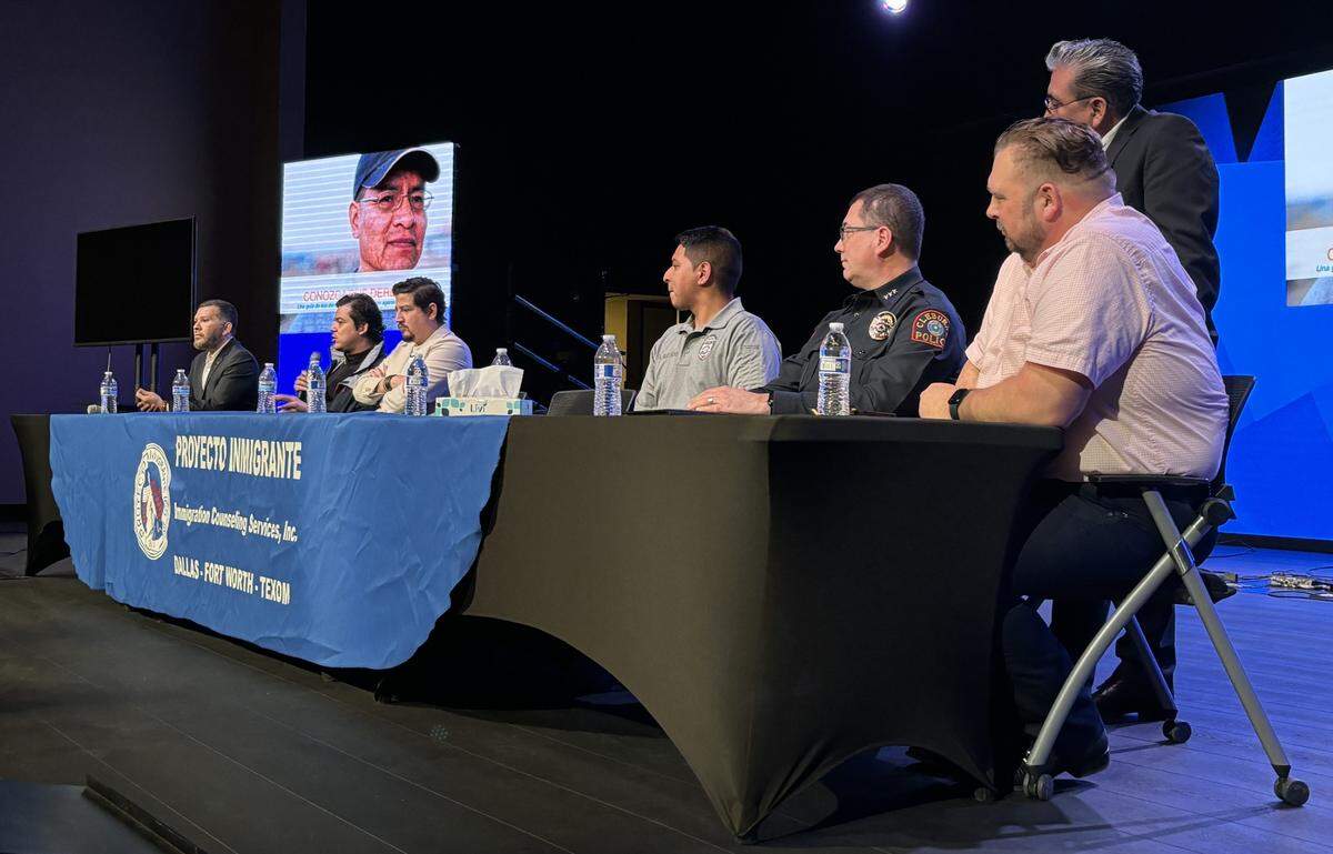 Officers of the Cleburne Police Department (seated right) listen to speakers at an information session about the Texas state border law known as SB 4 on Friday.