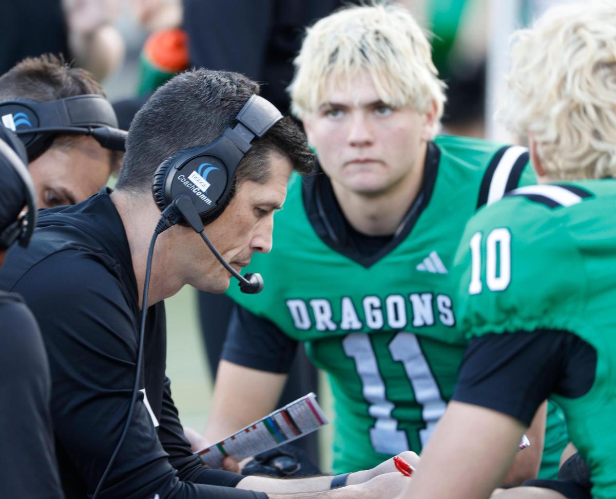 Southlake Carroll head coach Riley Dodge talks to the offense during the UIL 6A D2 Semifinals football game against Longview at Gerald J. Ford Stadium in University Park, Texas, Saturday, Dec. 14, 2024.