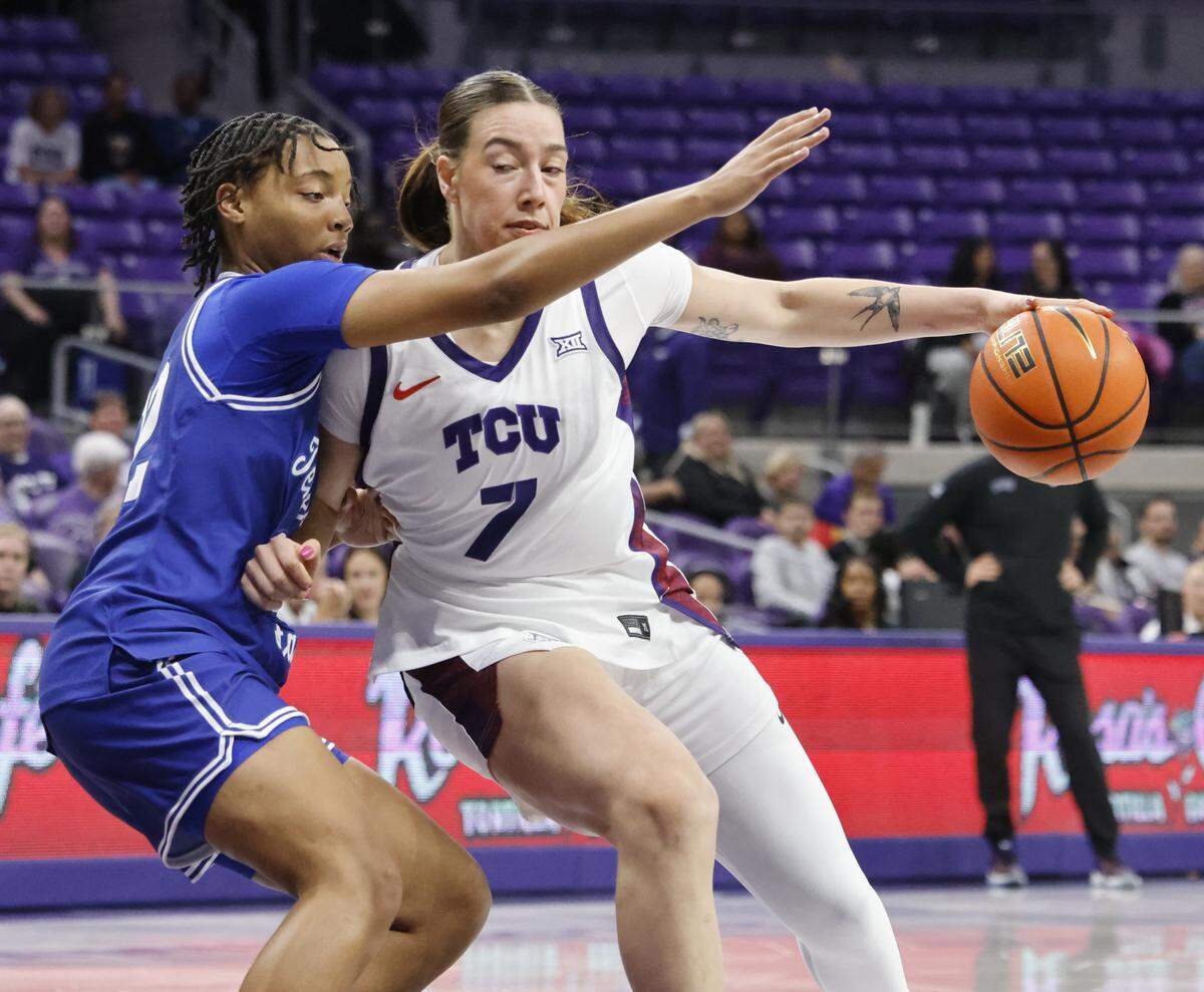 TCU forward Marta Suarez (7) attempts to maneuver around Tennessee State guard Erin Martin (22) during the first quarter of a NCAA women's basketball game between Tennessee State and TCU at Schollmaier Arena in Fort Worth, Texas, Wednesday Nov. 12, 2025.