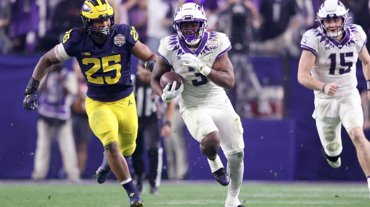 TCU running back Emari Demercado runs for 69 yards to give quarterback Max Duggan touchdown in the next play during their game against Michigan at the Vrbo Fiesta Bowl in Glendale, Ariz., on Saturday, December 31, 2022.