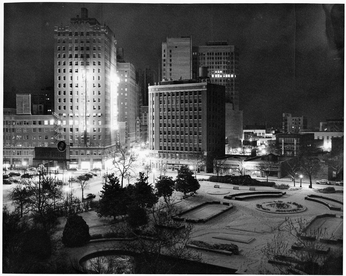 Jan. 24, 1948: “Burk Burnett Park at night in the snow, at 7th and Lamar streets; lights from surrounding buildings Texas Electric Service Company and Neil P. Anderson.”
