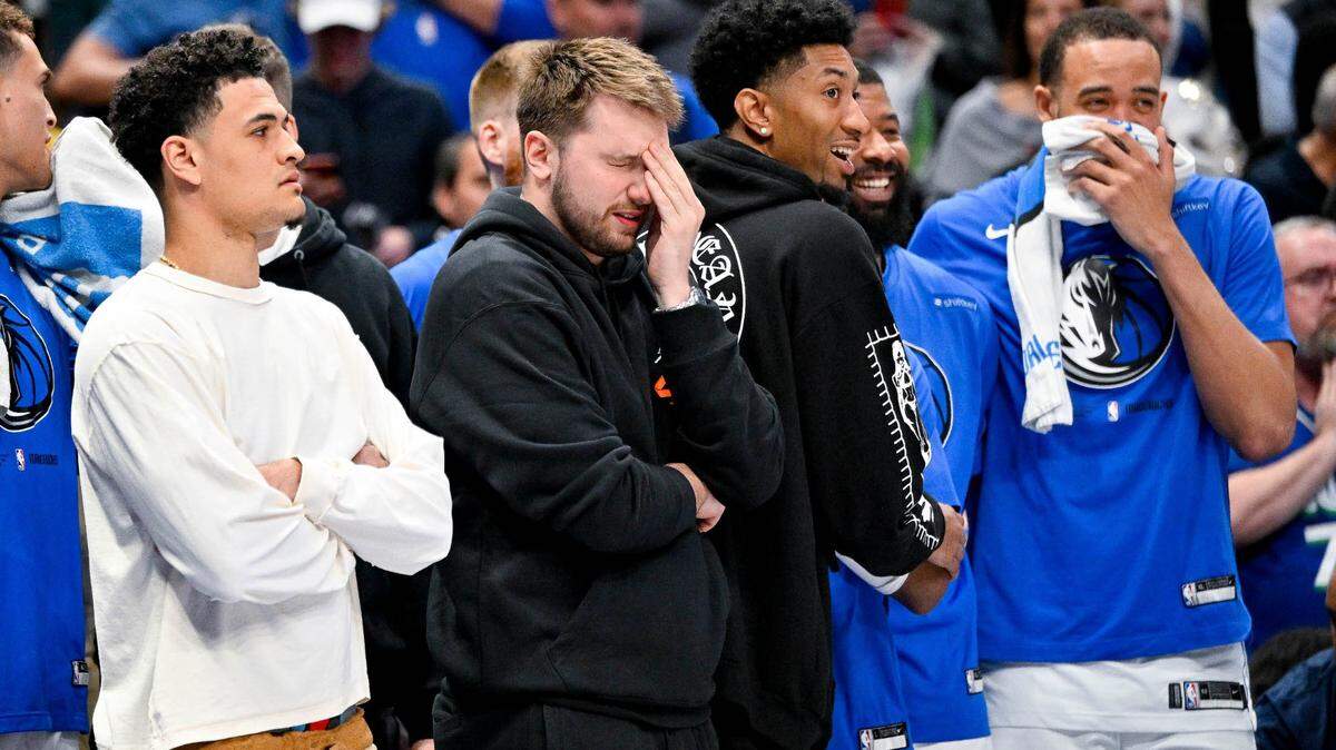 Mavericks guard Josh Green (8) and guard Luka Doncic (77) and forward Reggie Bullock (25) and forward Markieff Morris (13) and center JaVale McGee (00) watch the game between the Dallas Mavericks and the Chicago Bulls. The Mavericks were fined by the NBA for sitting players during this game agasint the Bulls.