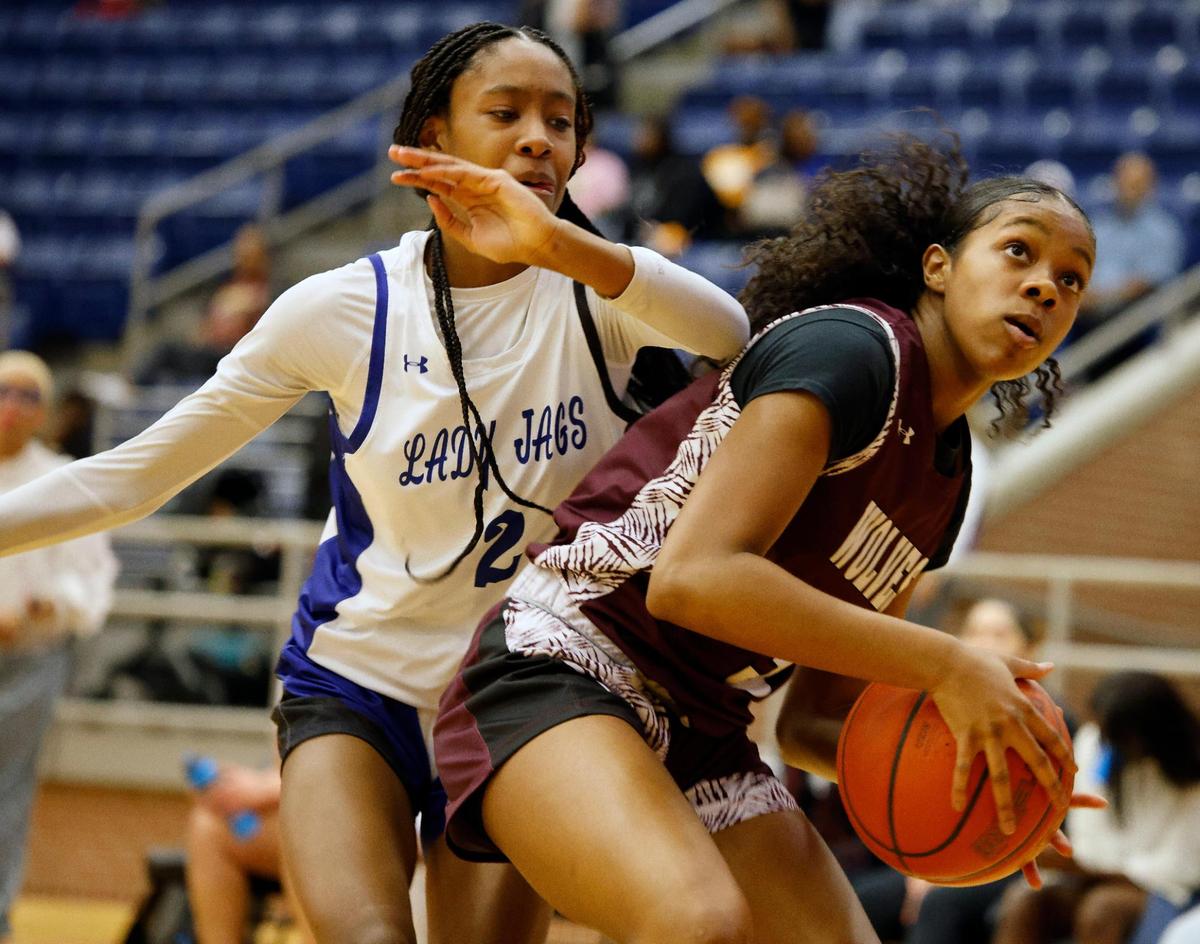 Summit shooting guard Aryn Williamson (2) attempts to block the shot of Timberview forward Faith McClellan (3) in the first half of a high school basketball game at Summit High School in Mansfield, Texas, Tuesday, Jan, 30, 2024.