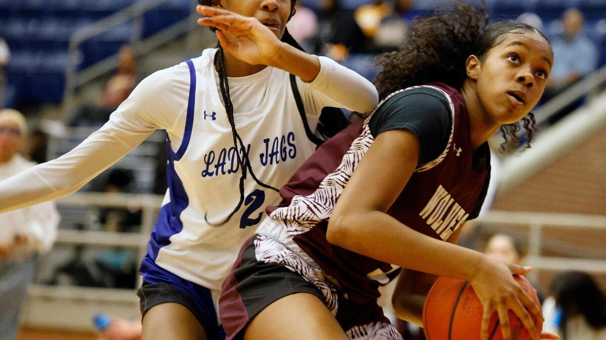 Summit shooting guard Aryn Williamson (2) attempts to block the shot of Timberview forward Faith McClellan (3) in the first half of a high school basketball game at Summit High School in Mansfield, Texas, Tuesday, Jan, 30, 2024.