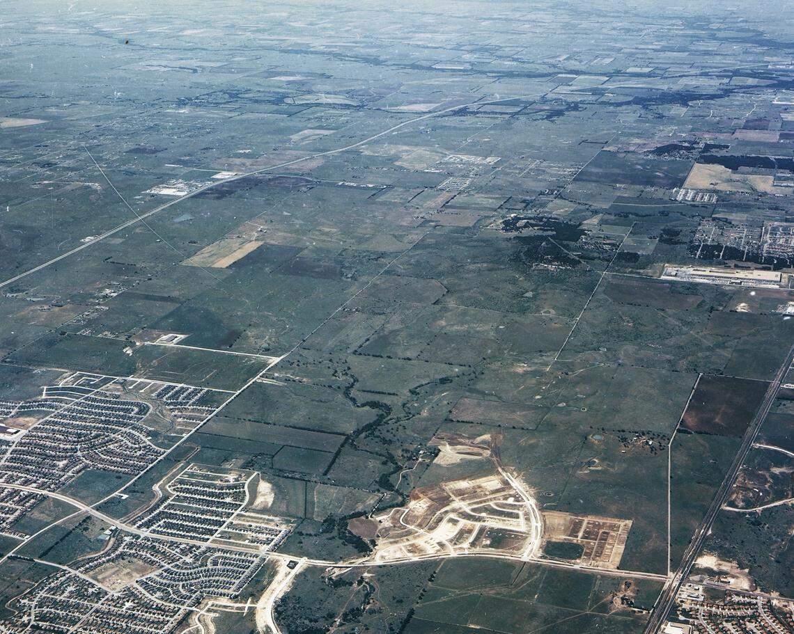 1988: Far north Fort Worth is mostly empty farmland. This photo looking northward shows Basswood Boulevard running east-west near the bottom of the photo, with U.S. 377 seen in the lower right and Interstate 35W in the distance near the top left. The construction in the foreground is the future Park Glen subdivision. Alliance does not yet exist.