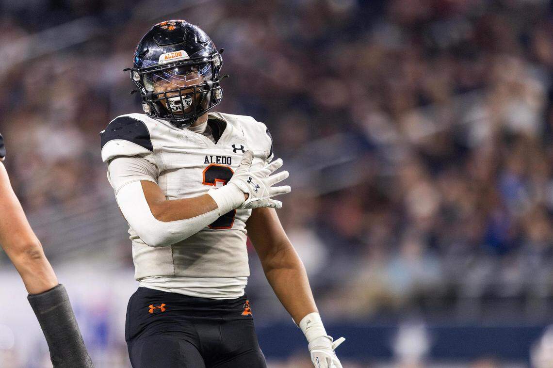 Aledo middle linebacker Davhon Keys (3) celebrates after getting a sack in the third quarter of the 5A Division I football state championship game against the Smithson Valley Rangers at AT&T Stadium in Arlington on Friday, Dec. 15, 2023. Aledo won 51-8 to capture the programs 12th state title.