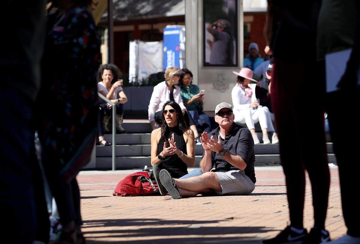 Audience members applaud Jordan Whitmore during the Fort Worth Art Fair on Friday, April 8, 2022, at Sundance Square Plaza. Both the Fort Worth Art Fair and the Main Street Arts Festival attracted crowds to downtown Fort Worth.