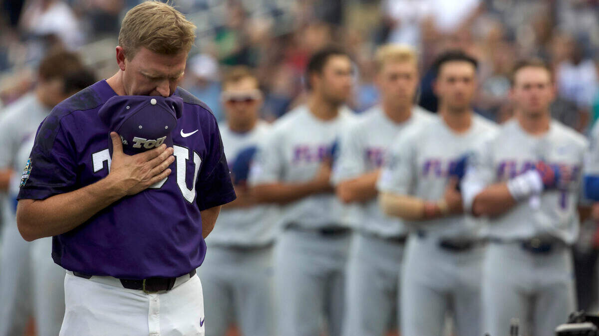 Former TCU Horned Frogs Jim Schlossnagle, shown observing the National Anthem prior to a 2017 College World Series game, is now the head coach at Texas A&M. Most of the current TCU roster either played for Schloss, or were his recruits.