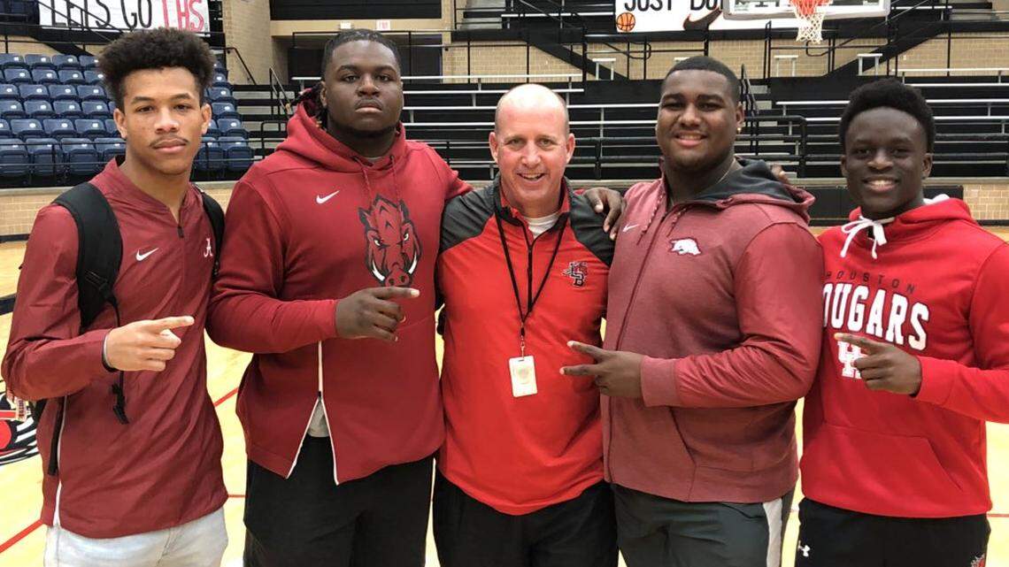 From left to right, Legacy seniors Jeffery Carter, Taurean Carter, head coach Chris Melson, Enoch Jackson and Ife Adeyi.