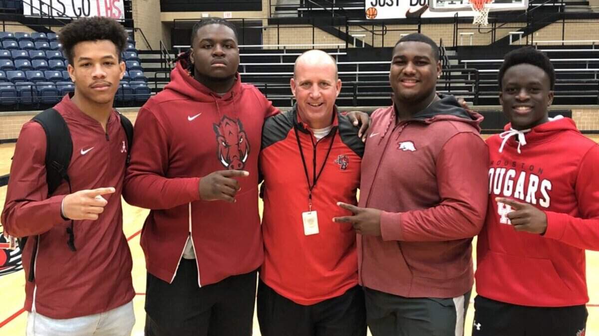 From left to right, Legacy seniors Jeffery Carter, Taurean Carter, head coach Chris Melson, Enoch Jackson and Ife Adeyi.