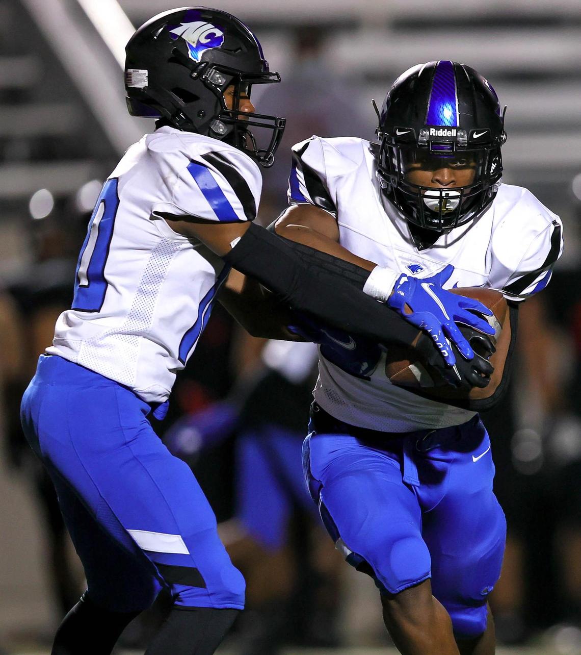 North Crowley quarterback Quinton Jackson (10) hands the ball off to running back DeJuan Lacy (R) during the first half of a high school football game, Thursday night, November 5, 2020 played at Pennington Field in Bedford, Tx. (Steve Nurenberg Special to the Star-Telegram)