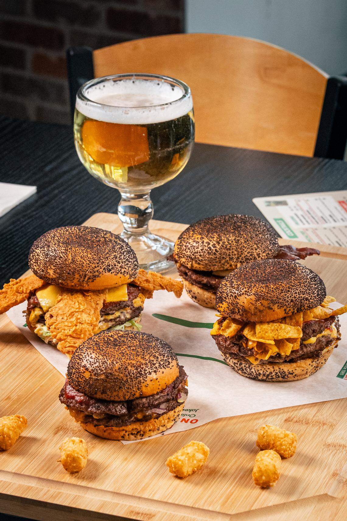 Jake’s Burgers and Beer is known for their half-pound burgers on poppy seed buns.