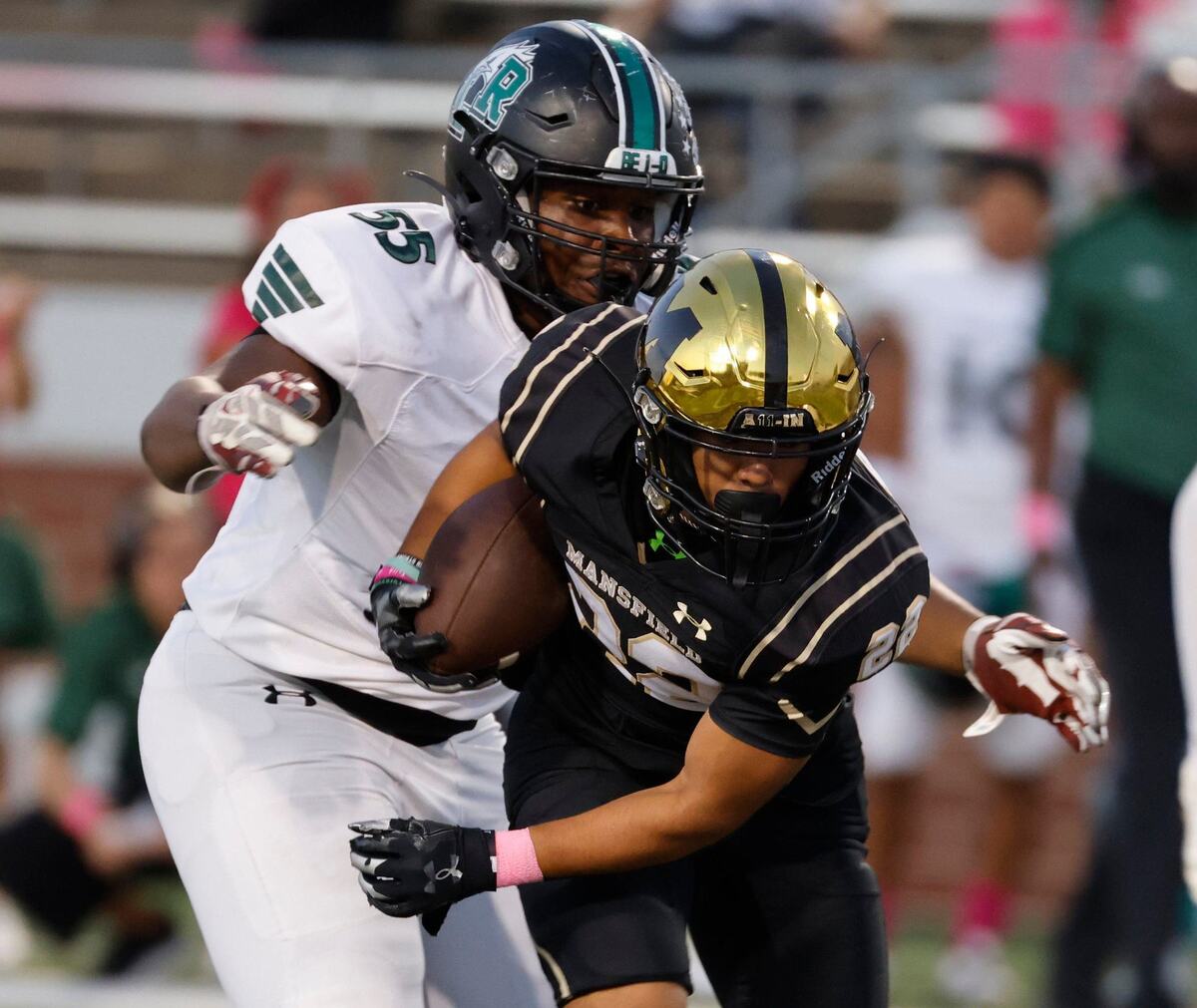 Lake Ridge defensive lineman Mason Johnson (55) zeros in on Mansfield running back Jayden Vasquez (22) during a UIL football game at Vernon Newsom Stadium in Mansfield Texas, Thursday, Oct. 03, 2024.
