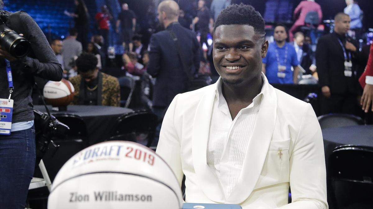 Zion Williamson, of Duke, smiles before the NBA basketball draft Thursday, June 20, 2019, in New York. (AP Photo/Julio Cortez)