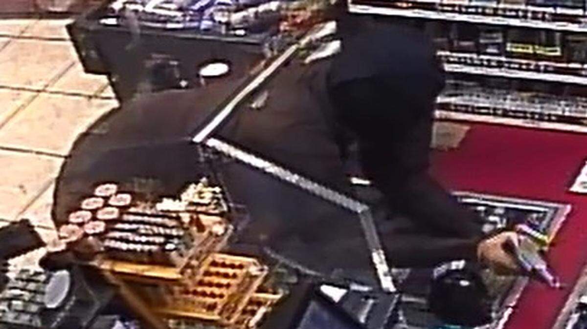 Surveillance video captured a robbery suspect climbing through a security window at a Fort Worth gas station last month.