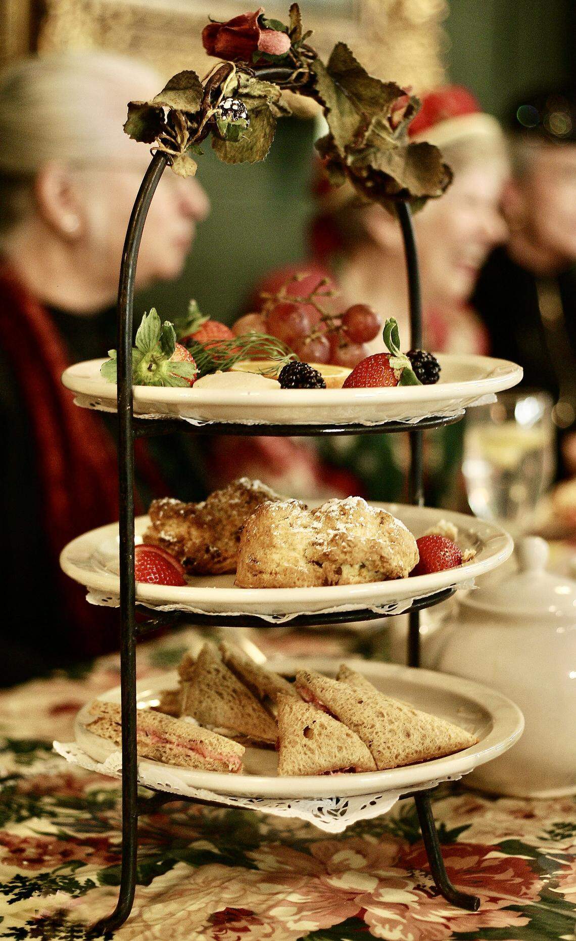 Plates of finger sandwiches, scones, fruit and cookies served with tea at the Secret Garden Restaurant tea room in the Montgomery Street Antique Mall. The restaurant serves an afternoon tea and can seat large groups.