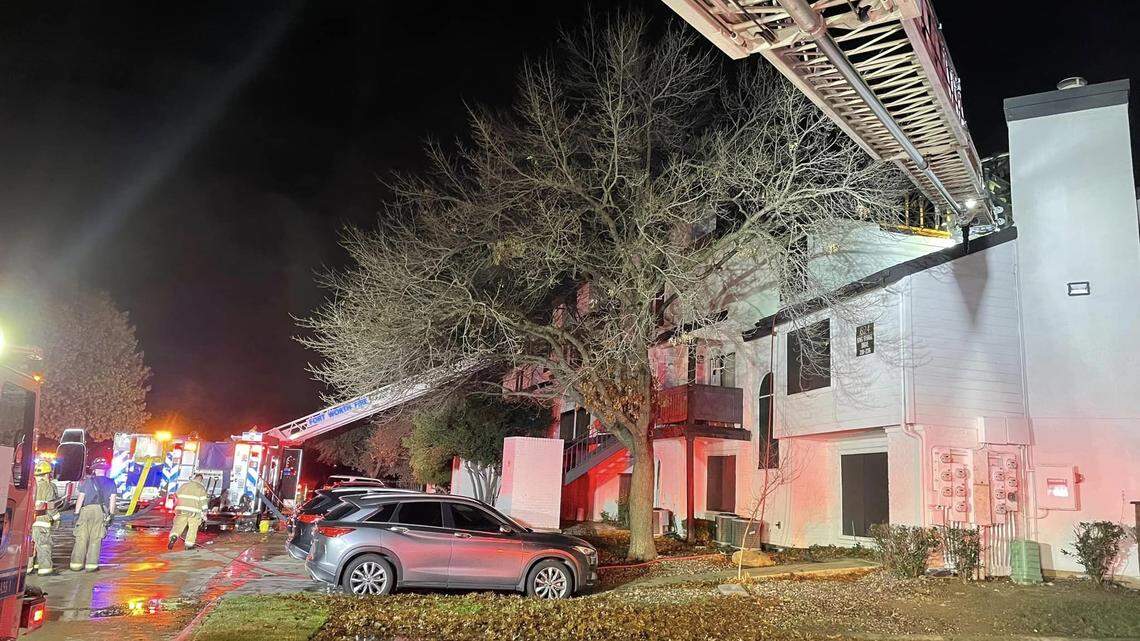 Fort Worth firefighters battled a blaze at an apartment complex on Dec. 24, 2023. A woman was arrested on suspicion of capital murder in connection with the deaths of two people found there.