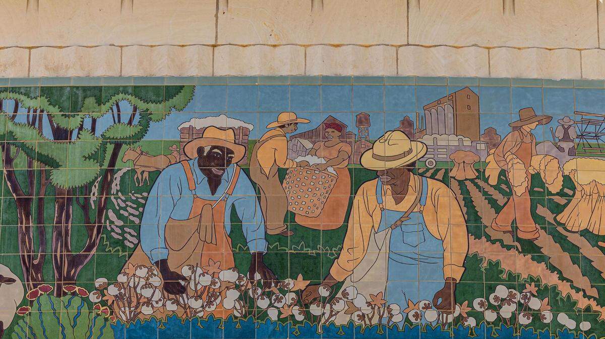 A portion of a mural depicting African American field workers picking cotton at the Will Rogers Memorial Auditorium in Fort Worth.