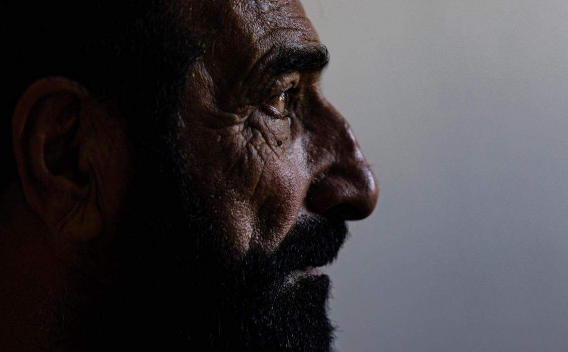 Mohammad Amini, an Afghan refugee who fled Afghanistan following the Taliban takeover, in his apartment living room in Fort Worth on Sept. 27, 2023. Amini was part of the armed forces helping Americans when he lived in Afghanistan. His work made him a target for the Taliban, which led to him and his family fleeing the country.
