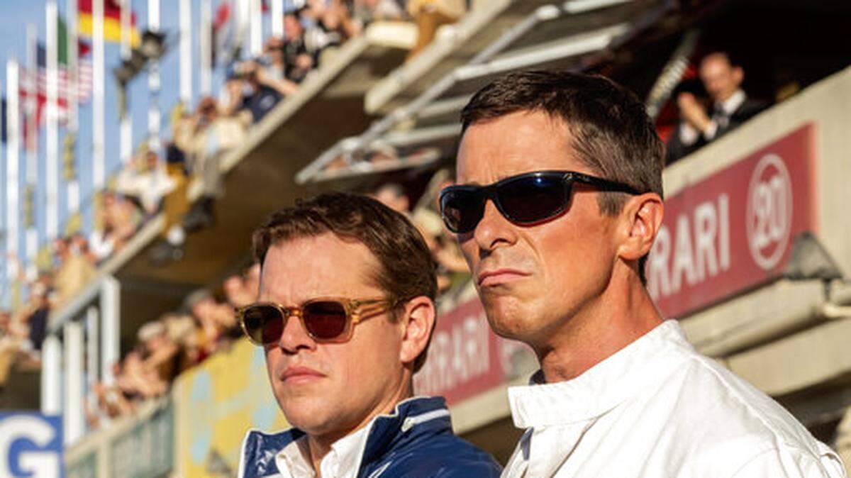 This image released by 20th Century fox shows Christian Bale, right, and Matt Damon in a scene from “Ford v. Ferrari.”