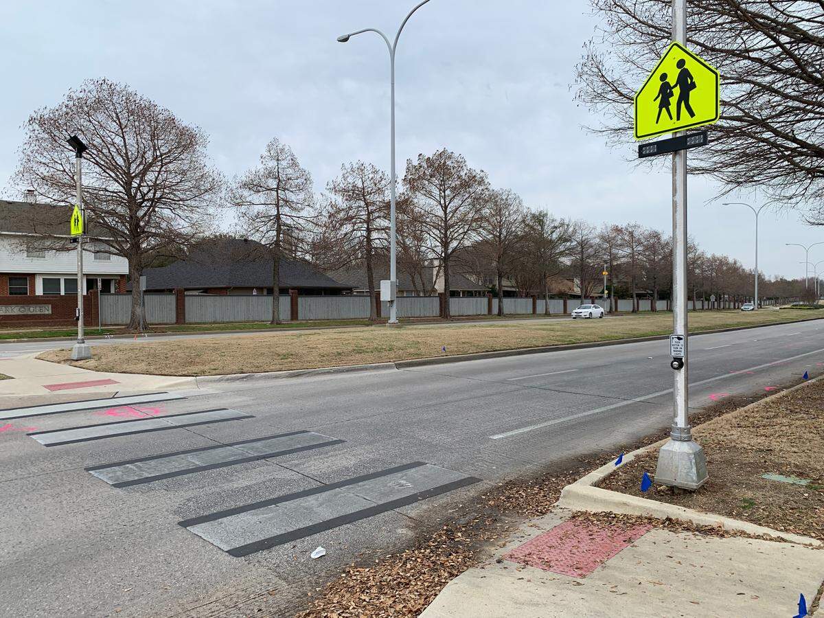 The intersection of Park Vista Boulevard and Glen Canyon Road at 3:54pm the day following the accident. Police investigators left pink markings on the road as they documented the scene. Nearby officers wouldn’t clarify the meaning of the markings.