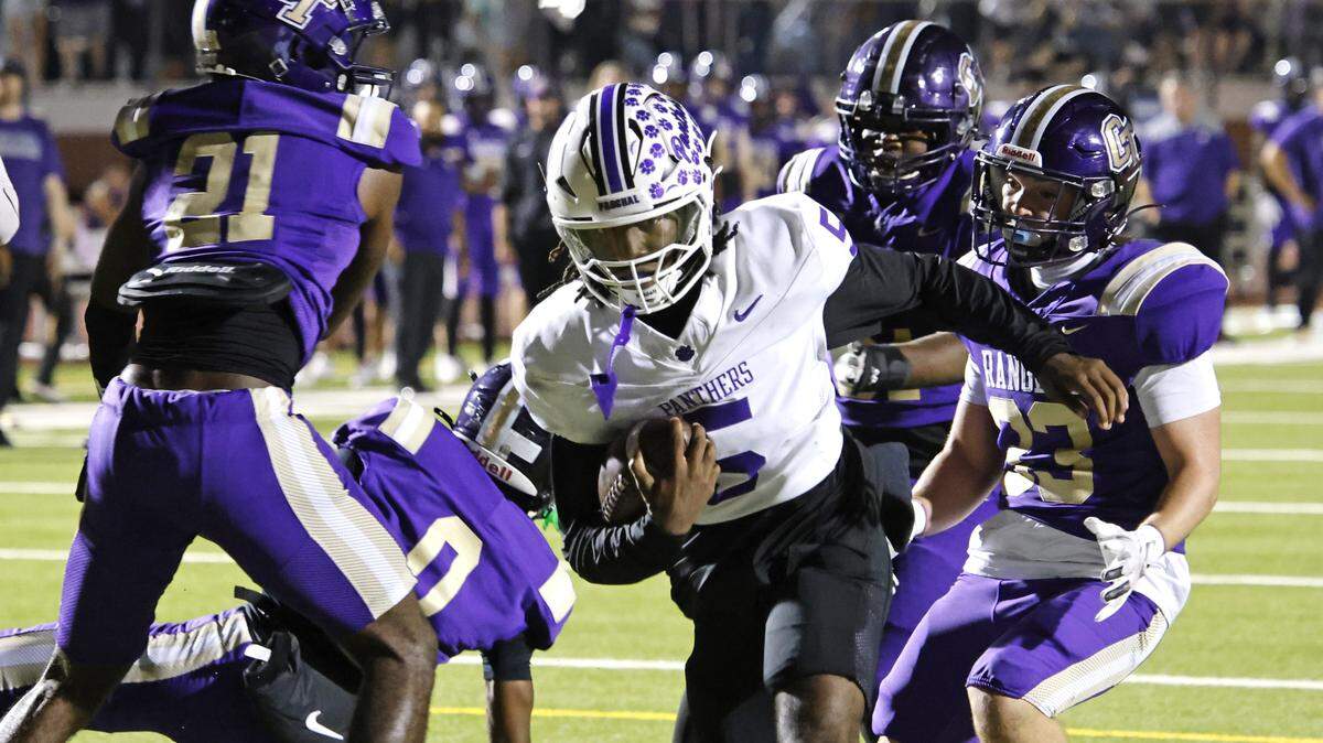 Paschal quarterback Jashaun Thomas (5) carries the ball into the end zone during the first half of a UIL football game between Paschal and Chisholm Trail at Ranger Stadium in Fort Worth, Texas, Friday, October. 03, 2025.