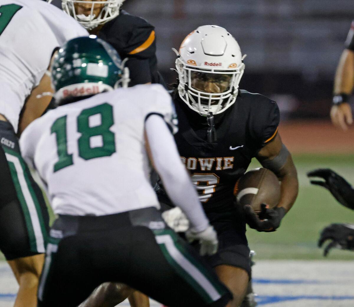 Bowie running back Darrion Bowers (6) faces down Arlington linebacker Drew Barrientes (18) at the line during a District 8-6A football game at C.H. Wilemon Field in Arlington, Texas, Friday, Oct. 18, 2024.