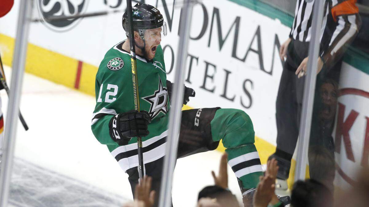 Dallas Stars center Radek Faksa (12) celebrates scoring a goal during the second period of an NHL hockey game against the Calgary Flames in Dallas, Tuesday, Dec. 18, 2018. (AP Photo/LM Otero)