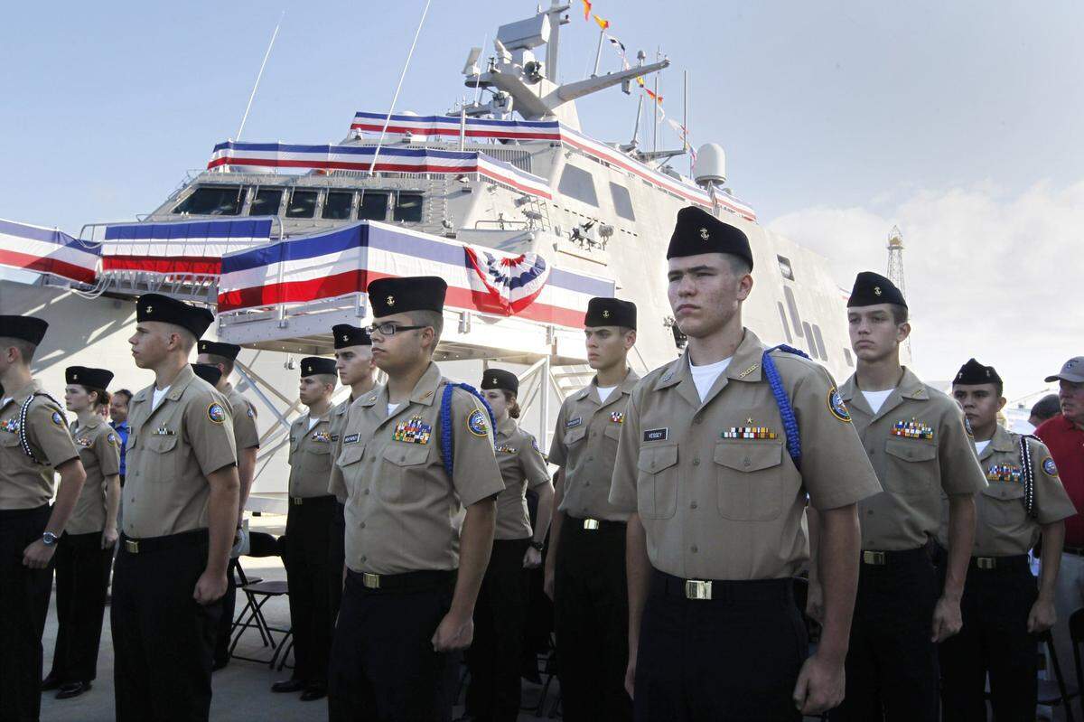 JROTC Navy sea cadets from Joshua High School stand at attention at the entrance to the commissioning ceremony for the USS Fort Worth in Galveston, Texas, on Sept. 22, 2012.