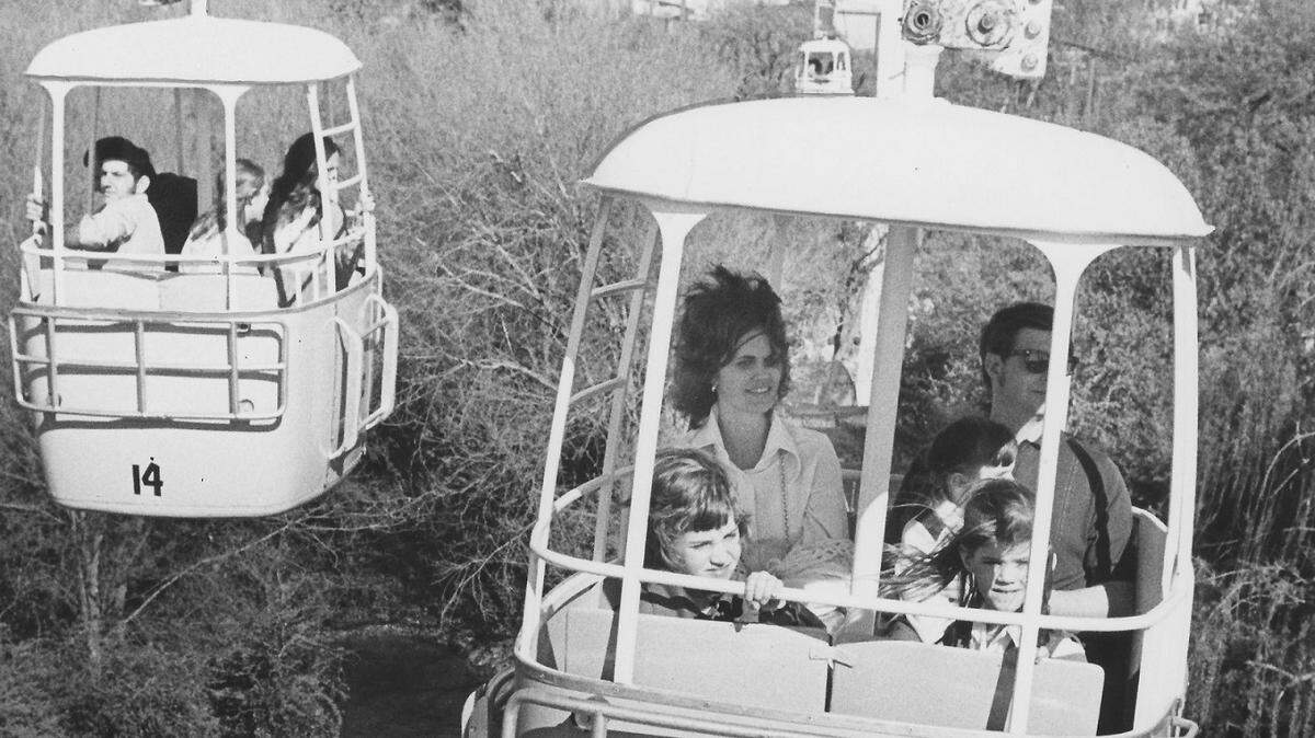 Circa 1973: People enjoying the rides at Six Flags over Texas in Arlington