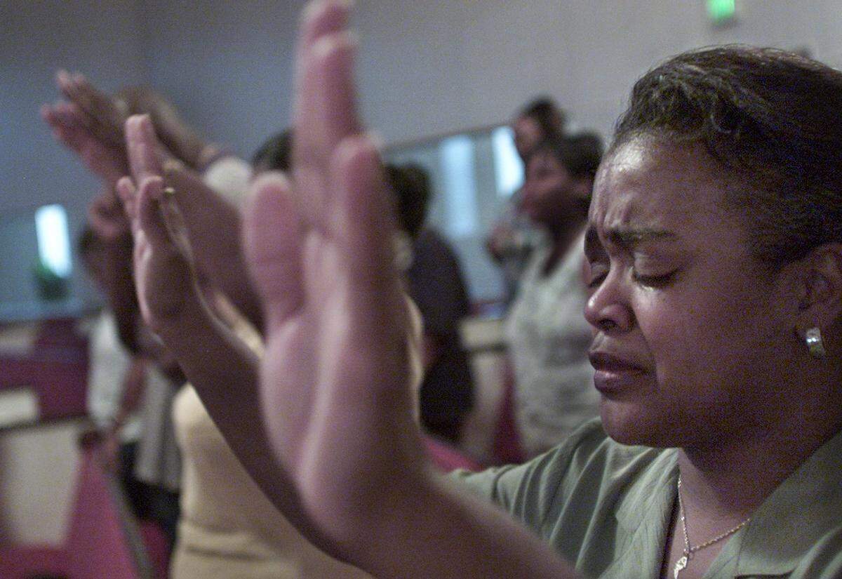 Sunday school teacher Sandra Powell in prayer at Rising Star Baptist Church in Fort Worth on Sept. 11.