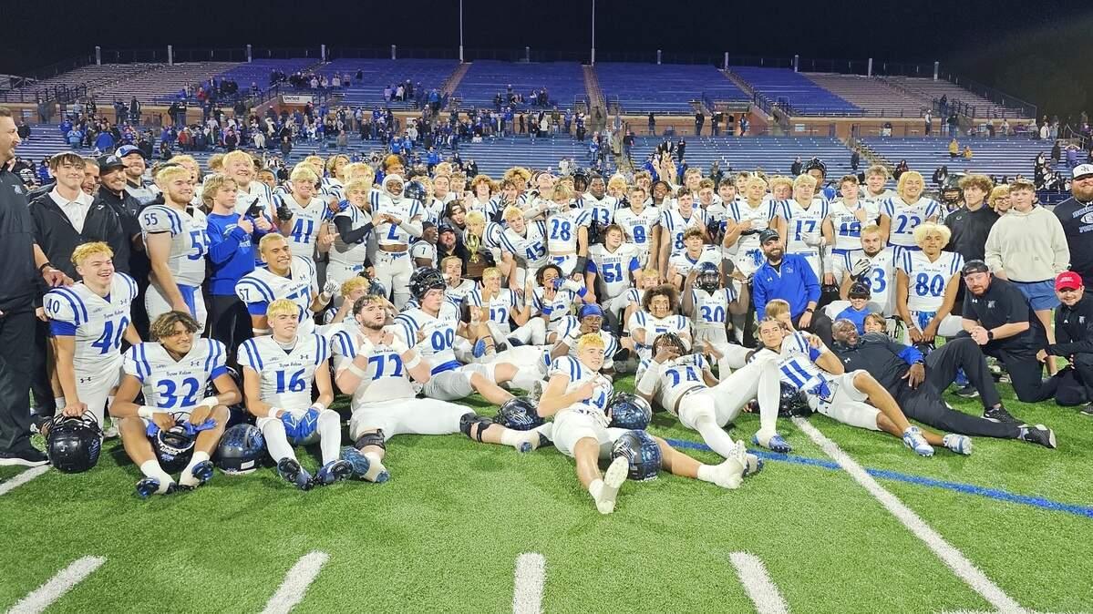 The Trophy Club Byron Nelson football team poses with the area-round trophy after defeating Midland High in a Class 6A Division 2 game on Friday, November 17, 2023 at Astound Broadband Stadium in Midland, Texas.