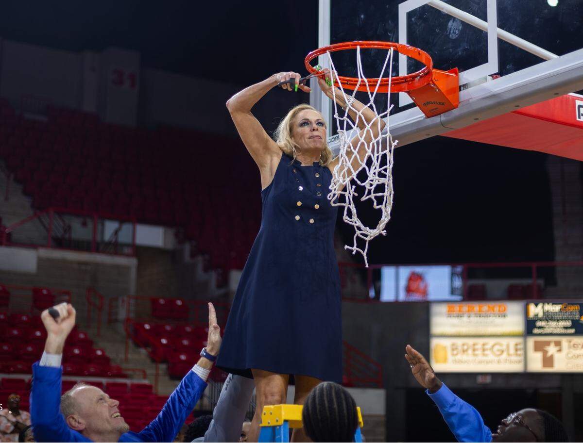 Mansfield Timberview girls basketball coach Kit Kyle takes her turn at cutting down the net after her team defeated Argyle 44-35 in the Class 5A Region I championship game on Saturday, February 24, 2024 at the Yeager Coliseum in Wichita Falls, Texas.