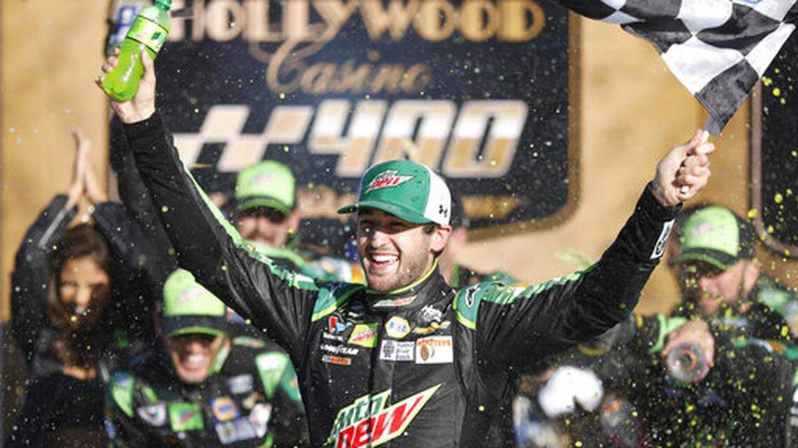 Chase Elliott celebrates winning a NASCAR Cup Series auto race at Kansas Speedway in Kansas City, Kan., Sunday, Oct 21, 2018. (AP Photo/Colin E. Braley)