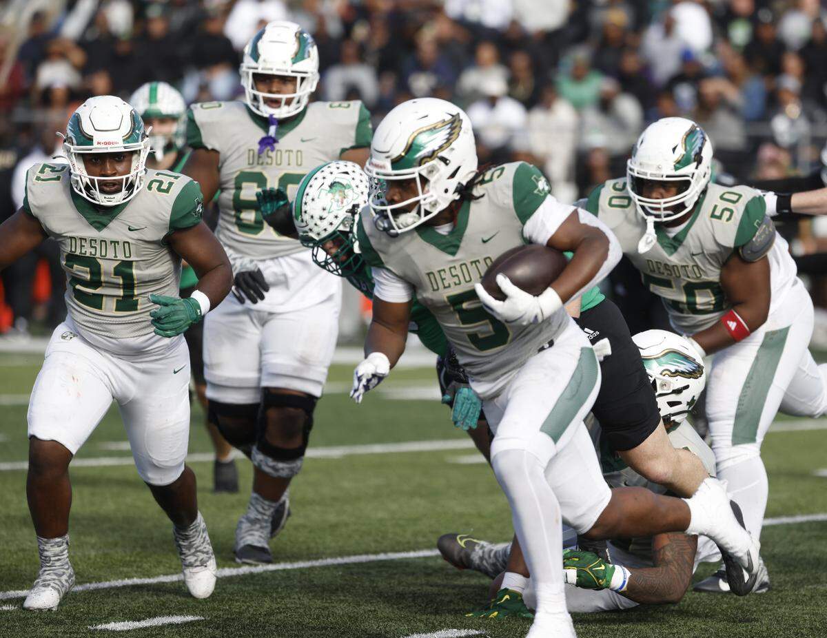 DeSoto running back SaRod Baker (5) rounds the left side against Southlake Carroll during the first half of a UIL Class 6A Division II semifinal on Saturday Dec. 13, 2025 at Vernon Newsom Stadium in Mansfield, Texas.